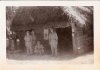 4 men in front of Infirmary.JPG